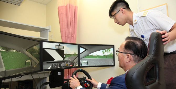 Staff member from Physiotherapy Department introduced the new interactive rehabilitation equipment to guest